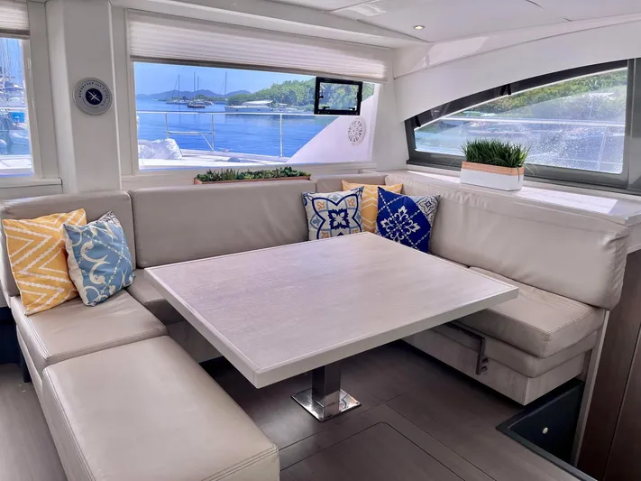 Ida Cat Yacht Photos Pics Luxurious interior of 2017 Leopard 51 Powercat with elegant seating and scenic window views.