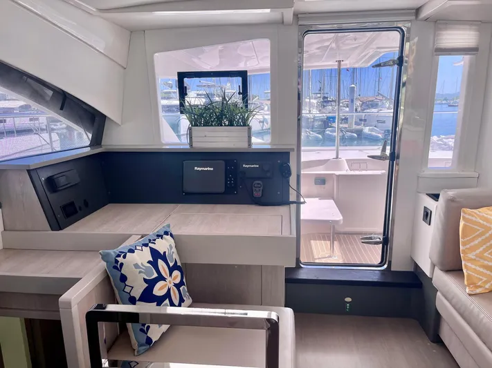 Ida Cat Yacht Photos Pics Interior of 2017 Leopard 51 Powercat yacht with modern decor and marina view.