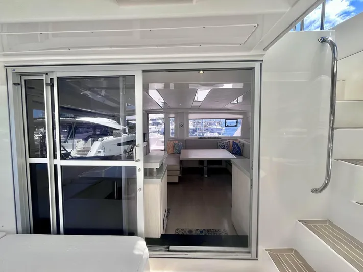 Ida Cat Yacht Photos Pics Interior view of 2017 Leopard 51 Powercat yacht with modern furnishings and large windows.