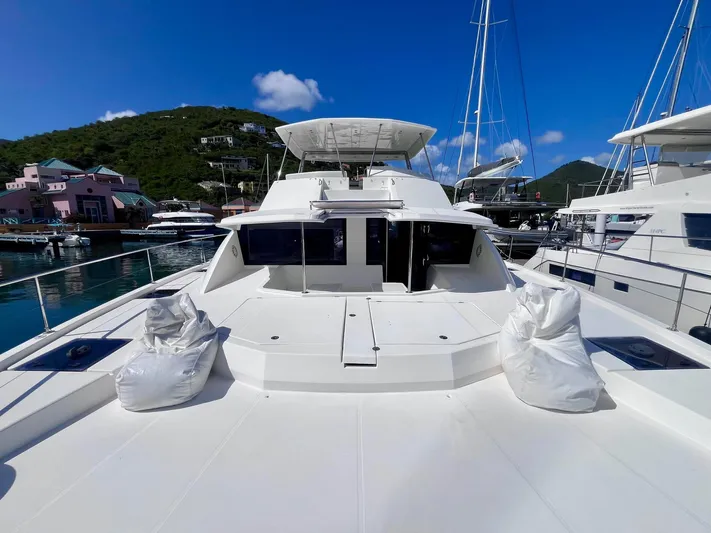 Ida Cat Yacht Photos Pics 2017 Leopard 51 Powercat yacht docked in a marina under clear blue skies.
