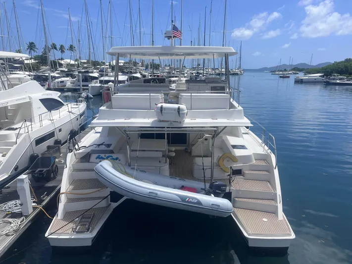 Ida Cat Yacht Photos Pics 2017 Leopard 51 Powercat docked in a marina with clear skies.