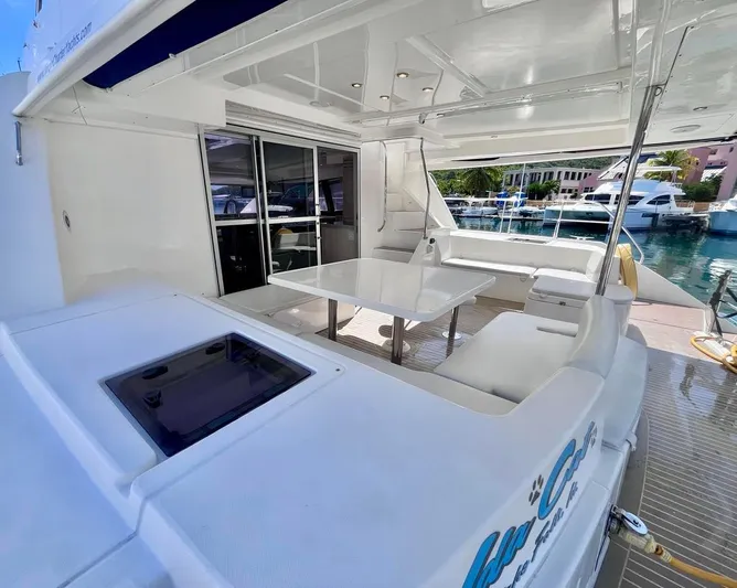 Ida Cat Yacht Photos Pics 2017 Leopard 51 Powercat yacht with spacious outdoor seating and dining area in marina.