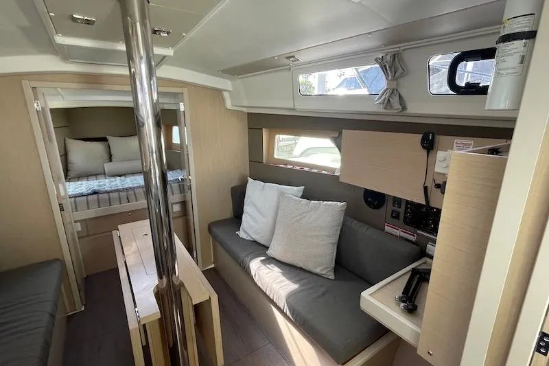 Dulce Vida Yacht Photos Pics Interior of 2022 Beneteau Oceanis 35.1 yacht, featuring cozy seating and modern design.