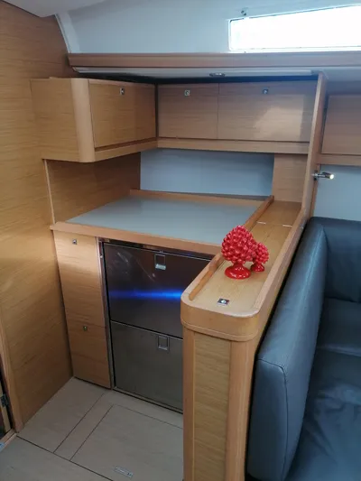  Yacht Photos Pics Interior of 2019 Dufour 460 Grand Large yacht with modern kitchen cabinetry.