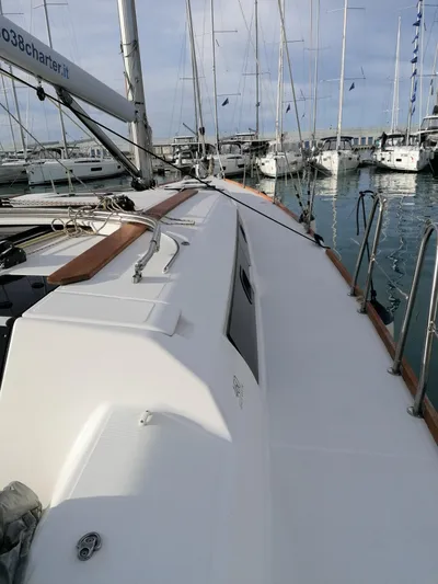  Yacht Photos Pics 2019 Dufour 460 Grand Large sailboat docked in marina, showcasing sleek deck design.