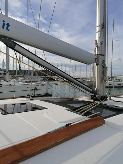  Yacht Photos Pics 2019 Dufour 460 Grand Large sailboat docked in marina, showcasing mast and deck details.