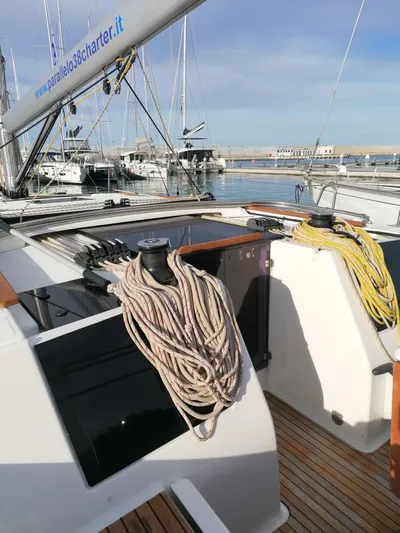  Yacht Photos Pics 2019 Dufour 460 Grand Large sailboat deck with ropes, docked in a marina.