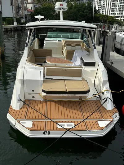  Yacht Photos Pics 2019 Sea Ray Sundancer 320 docked, featuring spacious deck and seating area.