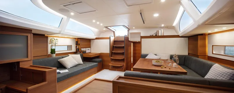  Yacht Photos Pics Luxurious interior of 2019 Solaris 64RS yacht with modern seating and dining area.