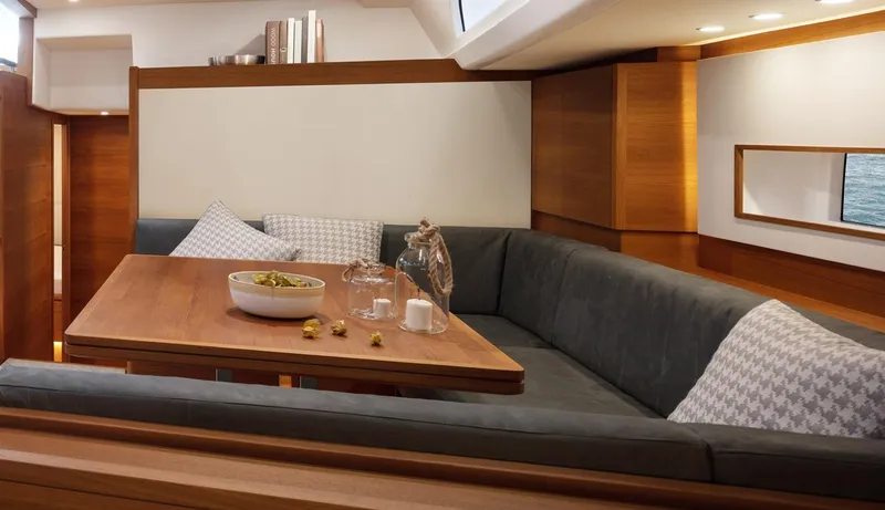  Yacht Photos Pics Luxurious interior of 2019 Solaris 64RS yacht with elegant dining area and plush seating.