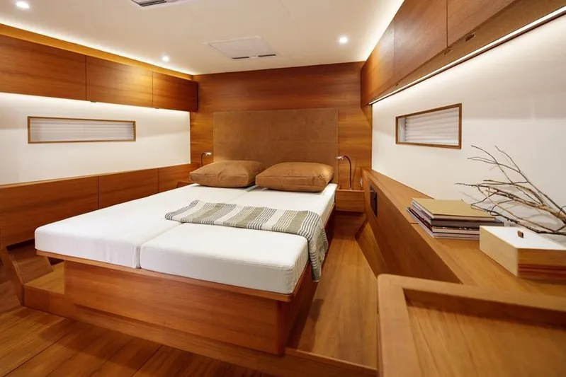  Yacht Photos Pics Luxurious wooden interior of 2019 Solaris 64RS yacht cabin with double bed.