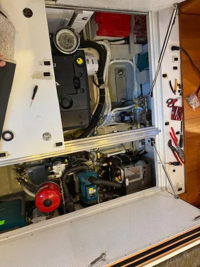  Yacht Photos Pics Engine compartment of 2019 Solaris 64RS yacht, showcasing tools and mechanical components.