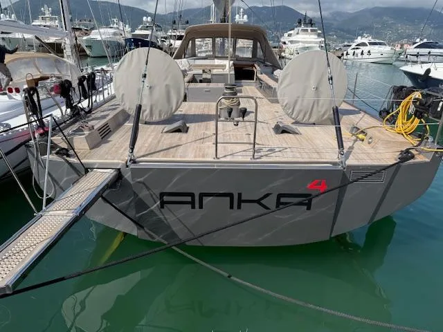  Yacht Photos Pics 2019 Solaris 64RS yacht with lifting keel, docked in a marina.