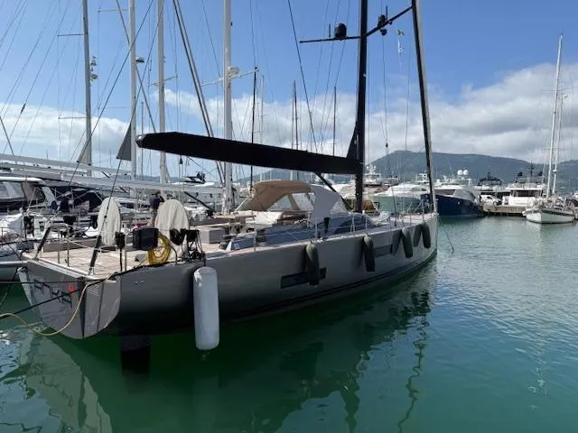  Yacht Photos Pics 2019 Solaris 64RS Lifting Keel yacht docked in a marina, surrounded by other boats.