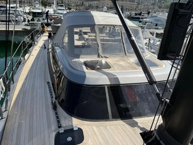  Yacht Photos Pics 2019 Solaris 64RS yacht with lifting keel, docked in a marina.