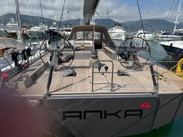  Yacht Photos Pics 2019 Solaris 64RS Lifting Keel yacht docked, featuring spacious deck and dual steering wheels.