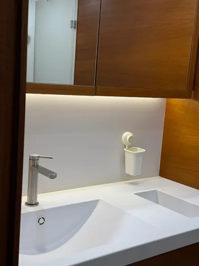  Yacht Photos Pics Modern bathroom sink with wooden cabinets on Solaris 64RS yacht, 2019 model.