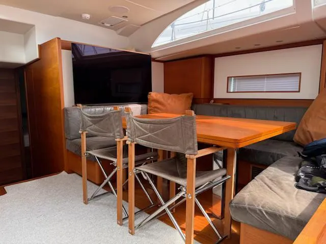  Yacht Photos Pics Luxurious interior of 2019 Solaris 64RS yacht with elegant dining area and modern furnishings.