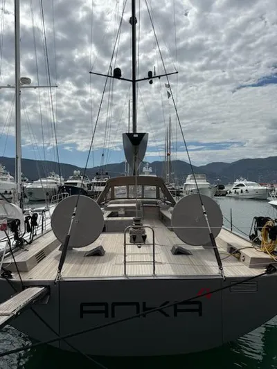  Yacht Photos Pics 2019 Solaris 64RS Lifting Keel yacht docked in marina, cloudy sky background.