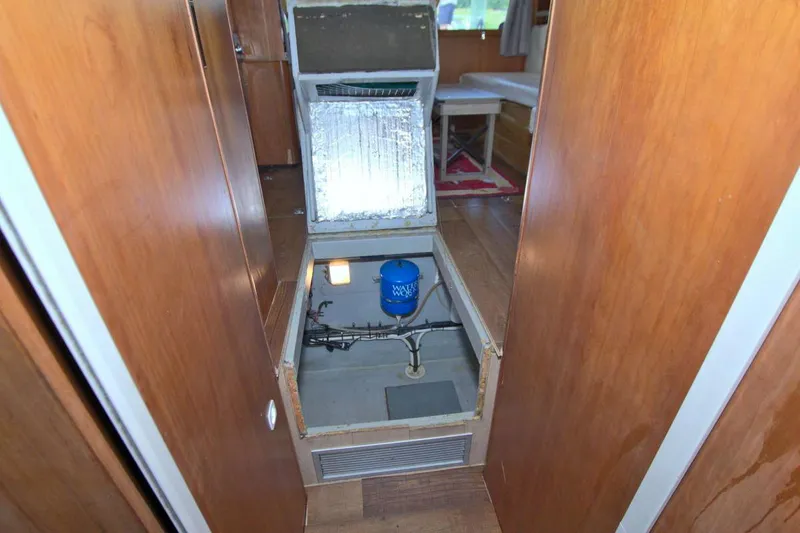 Fish Daddy Yacht Photos Pics 1998 Luhrs 36 Convertible interior with open hatch revealing mechanical components.