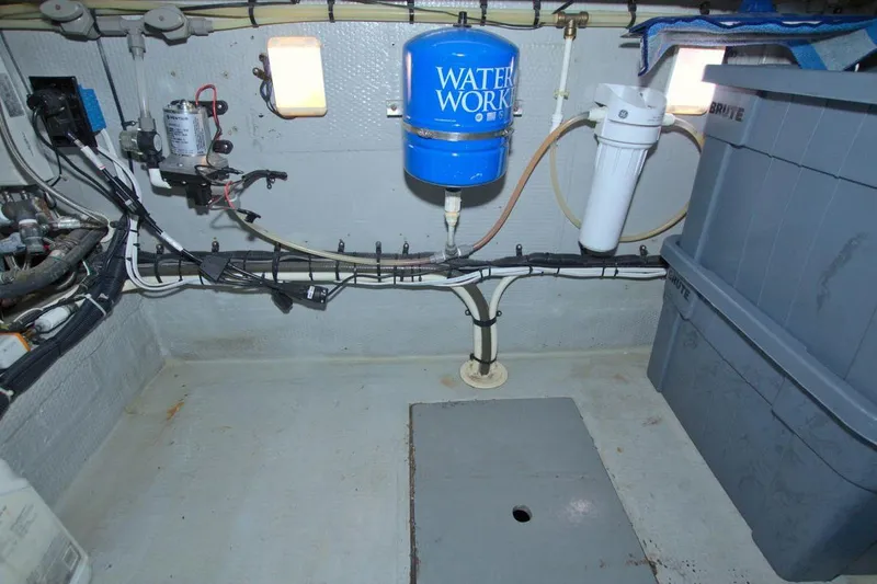Fish Daddy Yacht Photos Pics 1998 Luhrs 36 Convertible boat interior with water system and storage bins.