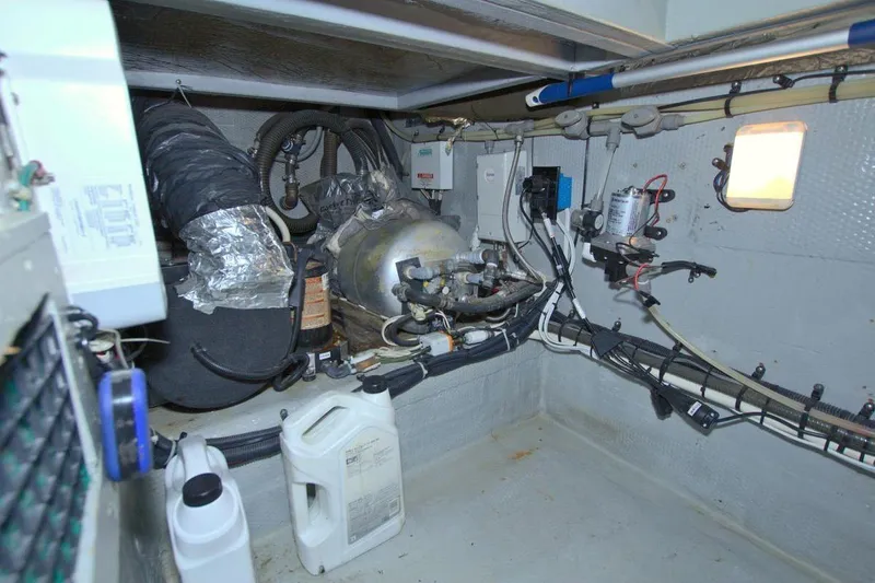 Fish Daddy Yacht Photos Pics Engine room of 1998 Luhrs 36 Convertible boat with mechanical equipment and wiring.