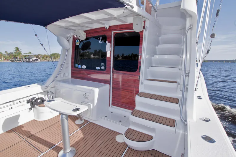 Fish Daddy Yacht Photos Pics 1998 Luhrs 36 Convertible yacht deck with stairs and fishing chair.