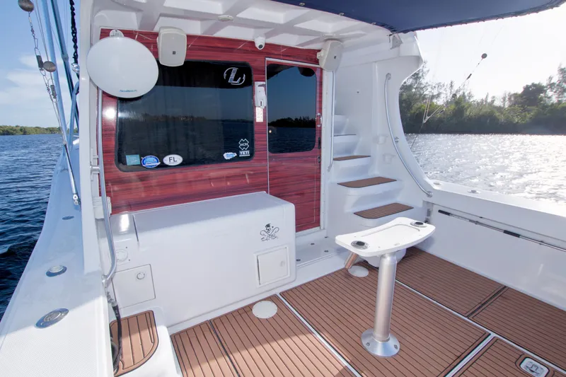 Fish Daddy Yacht Photos Pics 1998 Luhrs 36 Convertible boat interior with wooden deck and water view.