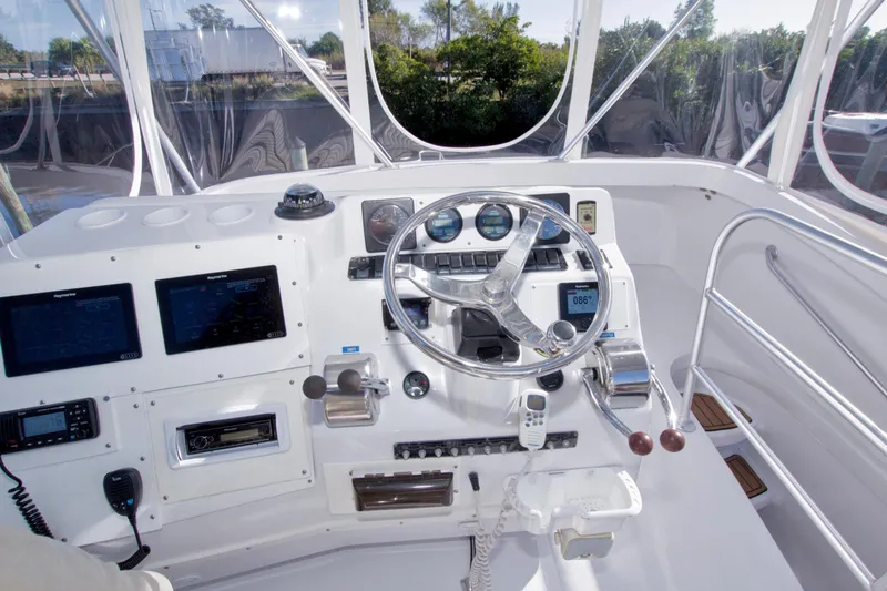 Fish Daddy Yacht Photos Pics 1998 Luhrs 36 Convertible boat helm with navigation instruments and steering wheel.