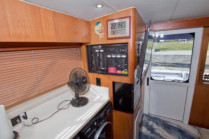 Fish Daddy Yacht Photos Pics Interior of 1998 Luhrs 36 Convertible yacht with control panel and fan.
