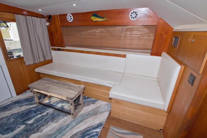 Fish Daddy Yacht Photos Pics Interior of 1998 Luhrs 36 Convertible yacht with white seating and wooden accents.