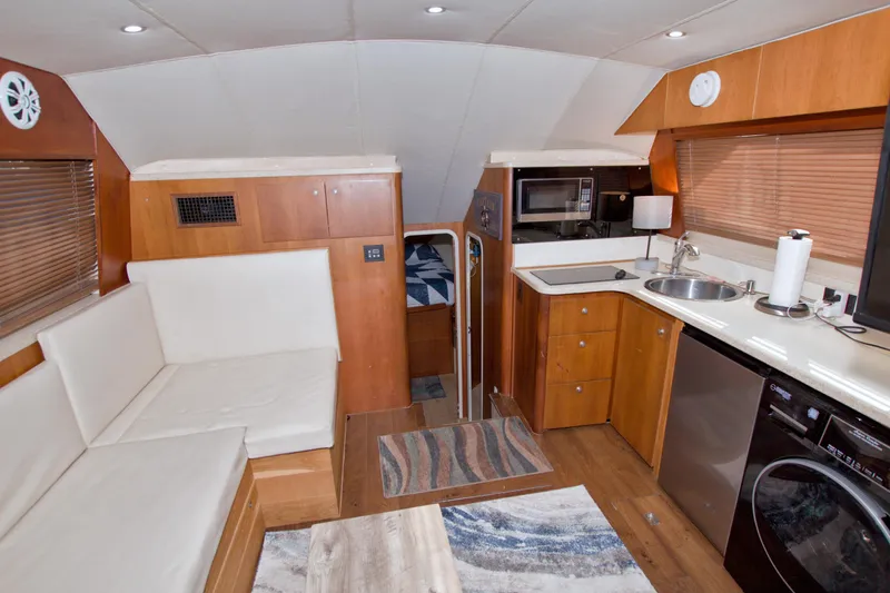 Fish Daddy Yacht Photos Pics 1998 Luhrs 36 Convertible yacht interior with kitchen, seating, and modern amenities.