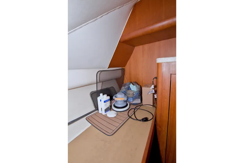 Fish Daddy Yacht Photos Pics Interior storage area of 1998 Luhrs 36 Convertible boat with cleaning supplies.