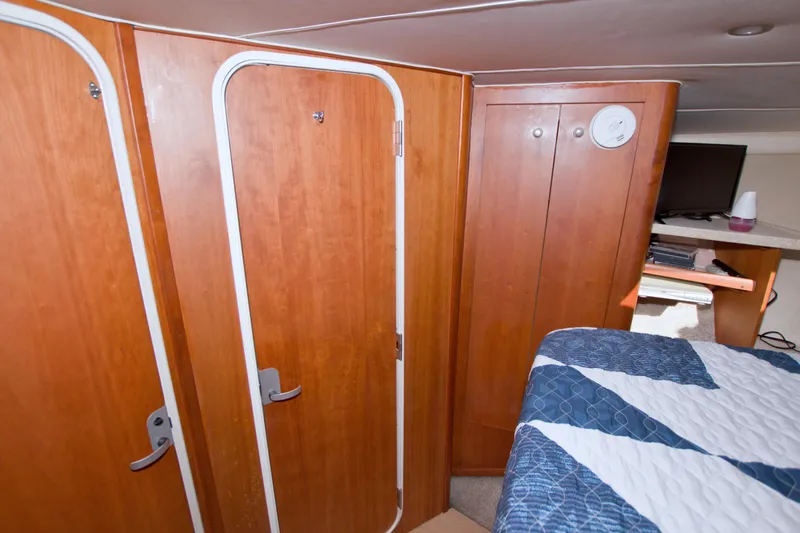 Fish Daddy Yacht Photos Pics Interior of 1998 Luhrs 36 Convertible boat with wooden cabinetry and bed.