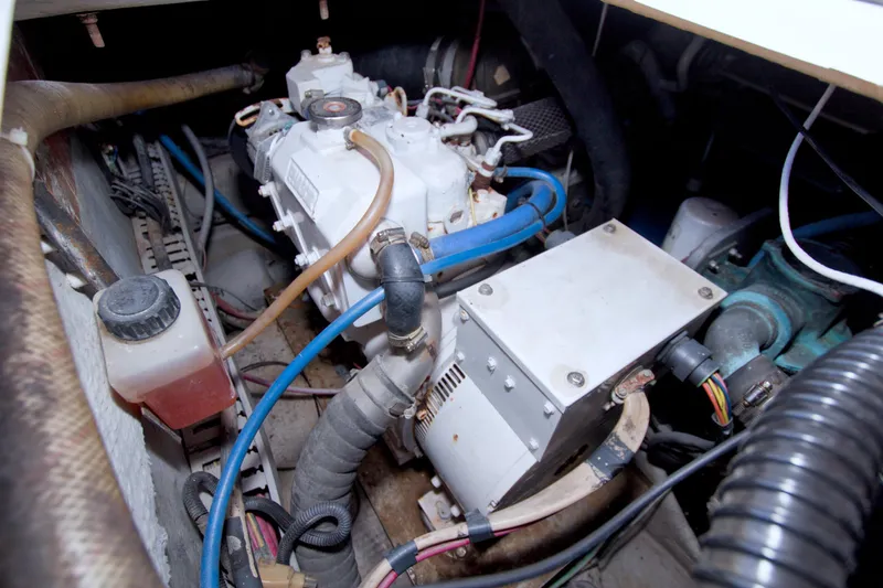 Fish Daddy Yacht Photos Pics Engine compartment of a 1998 Luhrs 36 Convertible boat, showcasing mechanical components.