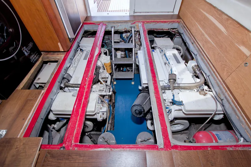 Fish Daddy Yacht Photos Pics Engine room of 1998 Luhrs 36 Convertible boat, showcasing dual engines and equipment.