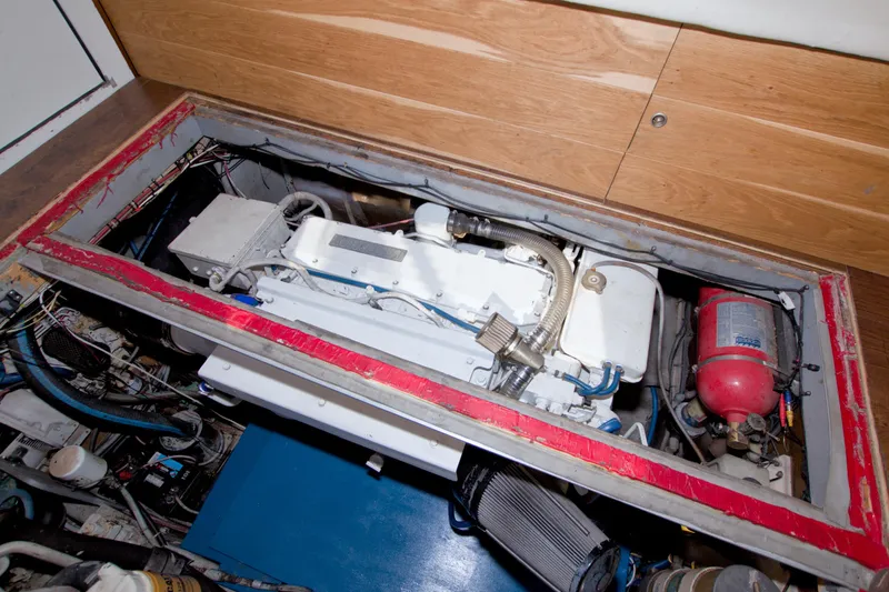 Fish Daddy Yacht Photos Pics Engine compartment of a 1998 Luhrs 36 Convertible boat, showcasing mechanical components.