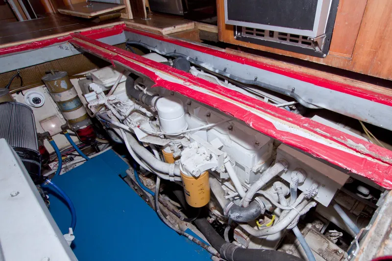 Fish Daddy Yacht Photos Pics Engine room of 1998 Luhrs 36 Convertible boat, showcasing mechanical components and piping.