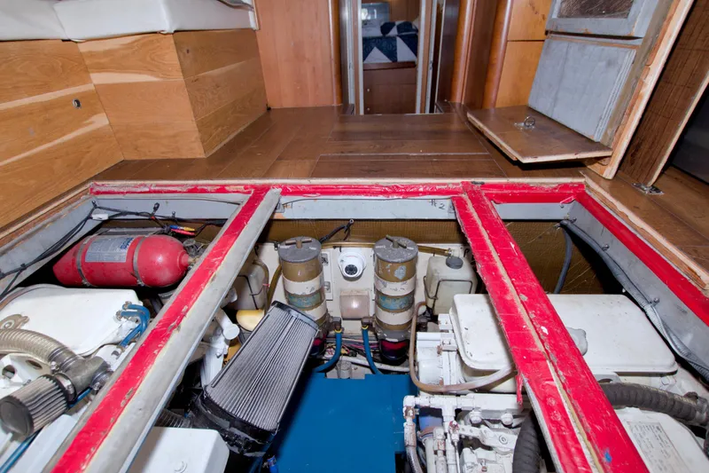 Fish Daddy Yacht Photos Pics Engine room of 1998 Luhrs 36 Convertible boat with visible components and fire extinguisher.