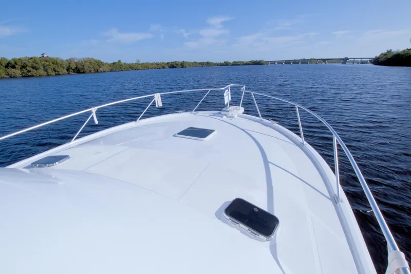 Fish Daddy Yacht Photos Pics Bow view of 1998 Luhrs 36 Convertible yacht cruising on a calm river.