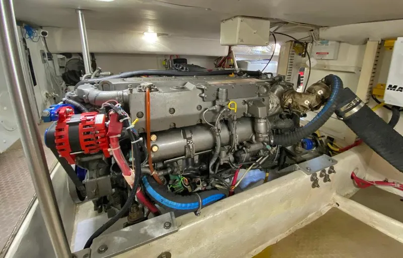Sandpiper Yacht Photos Pics Engine room of a 2004 Mainship 340 boat, showcasing detailed mechanical components.