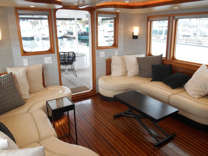 Suspense Yacht Photos Pics Luxurious interior of a 2005 Inace Trawler with elegant seating and wooden flooring.