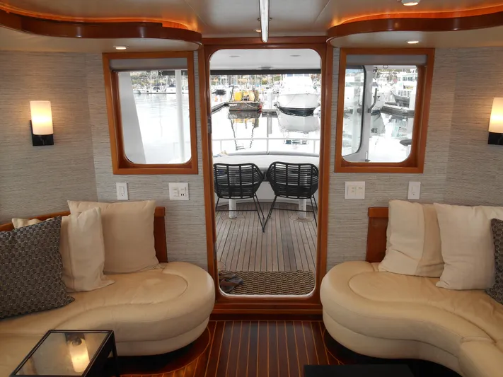 Suspense Yacht Photos Pics Luxurious 2005 Inace Trawler interior with plush seating and marina view.