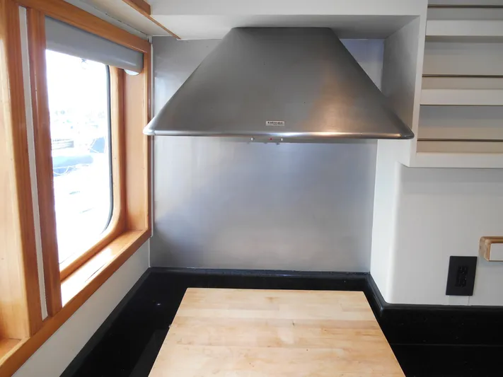 Suspense Yacht Photos Pics Stainless steel kitchen hood in 2005 Inace Trawler yacht interior.