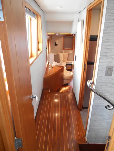 Suspense Yacht Photos Pics Interior of 2005 Inace Trawler with wooden flooring and modern furnishings.