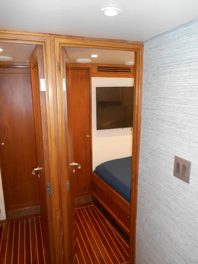 Suspense Yacht Photos Pics Interior of 2005 Inace Trawler with wooden doors and cozy cabin.