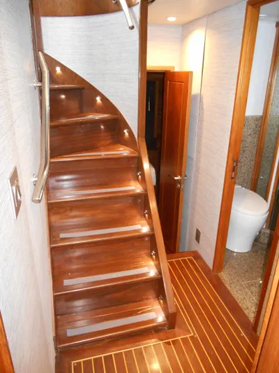 Suspense Yacht Photos Pics Wooden staircase with LED lights on a 2005 Inace Trawler yacht interior.