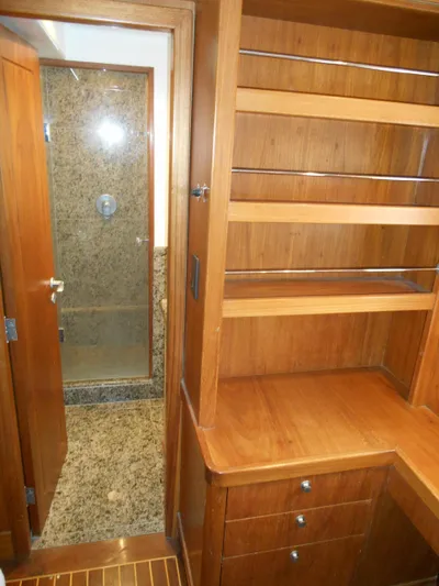 Suspense Yacht Photos Pics 2005 Inace Trawler interior with wooden shelves and granite shower.