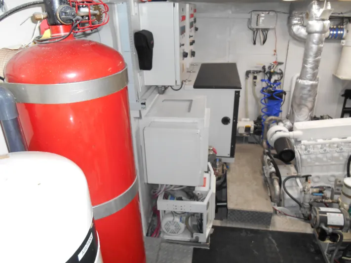 Suspense Yacht Photos Pics Engine room of a 2005 Inace Trawler with machinery and equipment.