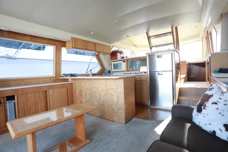 Ecto Boyz Yacht Photos Pics Interior of 2005 Navigator 53 Classic yacht with kitchen and seating area.